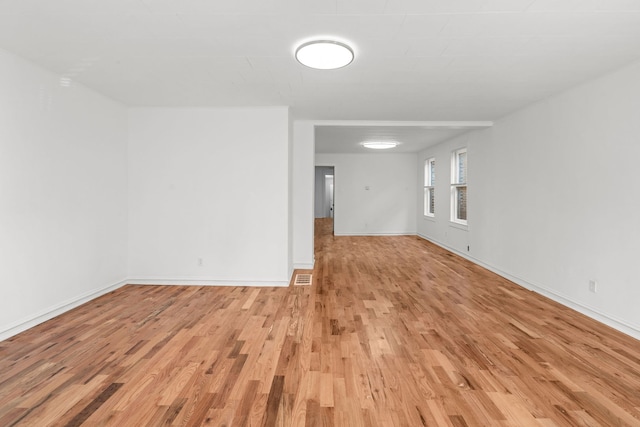 unfurnished room featuring light hardwood / wood-style flooring