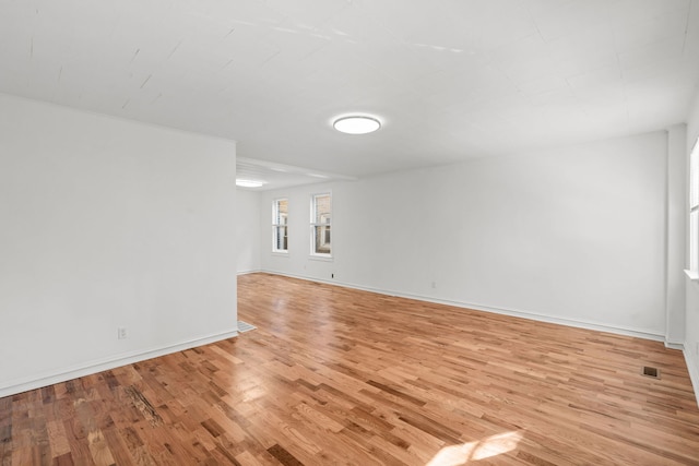 spare room featuring light hardwood / wood-style floors