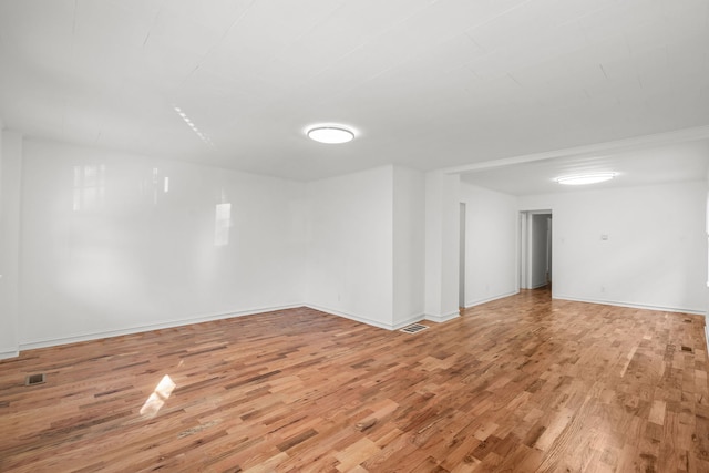 unfurnished room with light hardwood / wood-style flooring