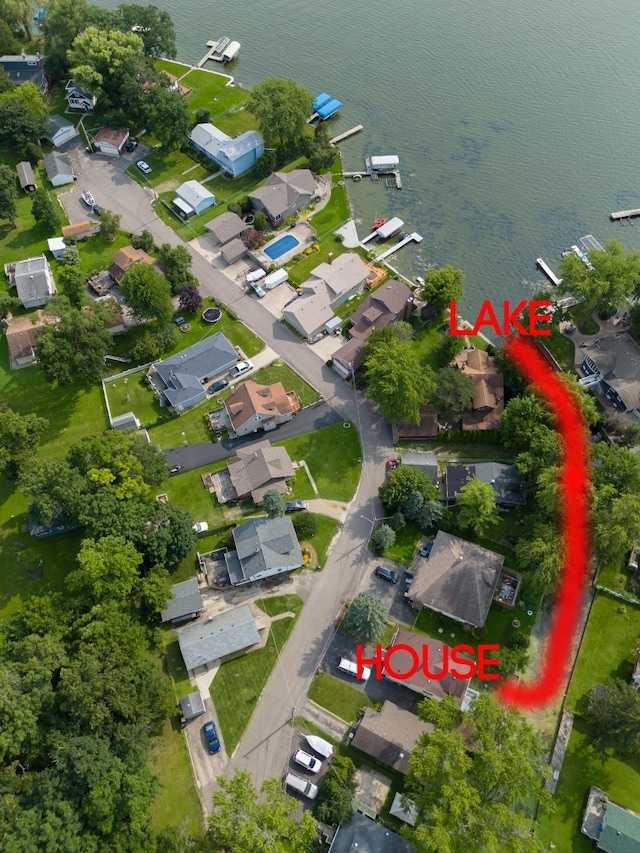 birds eye view of property featuring a water view