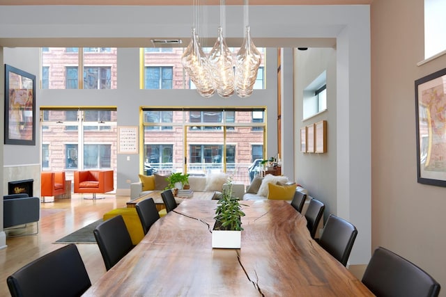 dining space with a chandelier and wood-type flooring