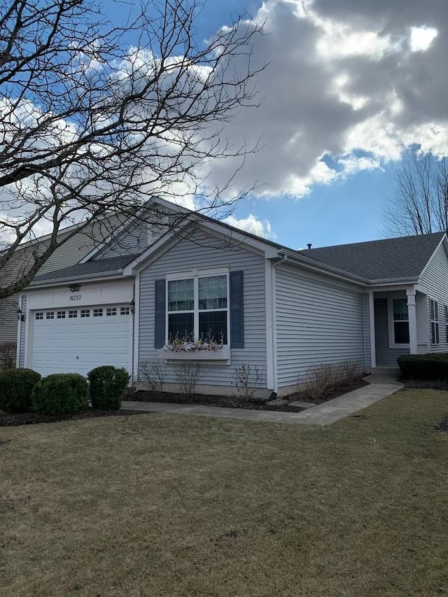 view of home's exterior with a lawn and an attached garage