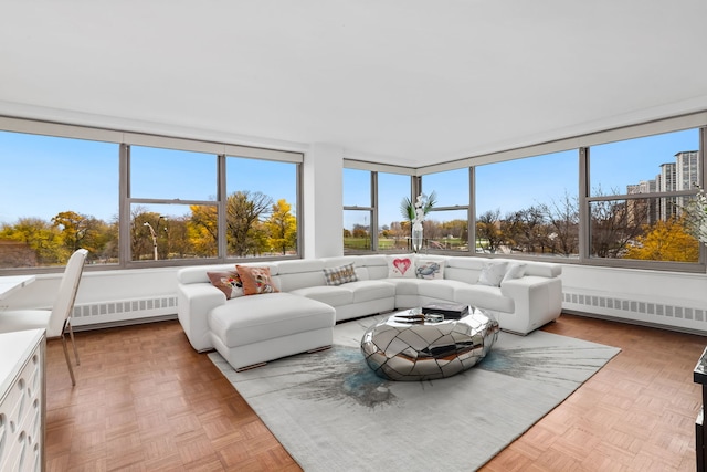 sunroom / solarium featuring radiator heating unit