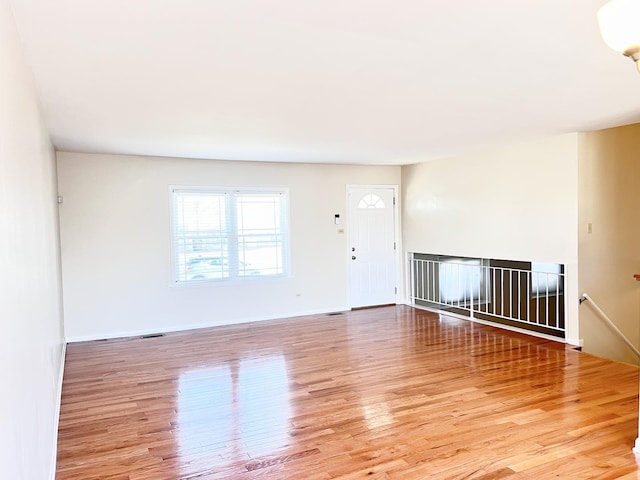 spare room featuring light hardwood / wood-style flooring