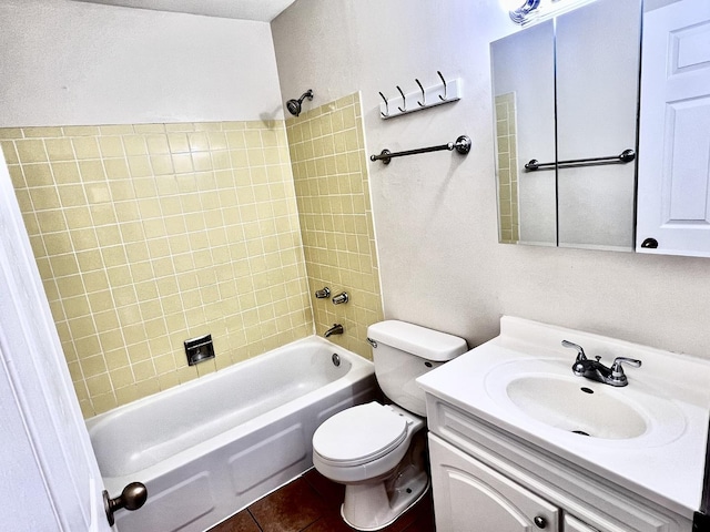 full bathroom with tile patterned floors, vanity, toilet, and tiled shower / bath