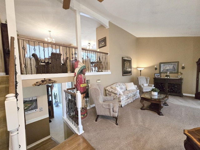 carpeted living room with ceiling fan with notable chandelier and lofted ceiling