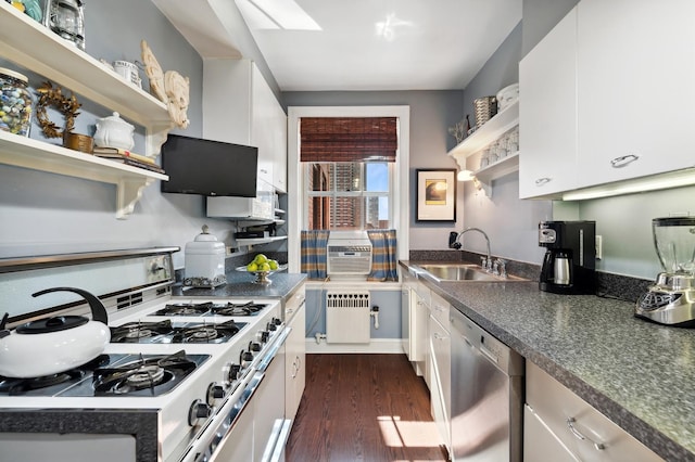 kitchen featuring dishwasher, radiator, white cabinets, sink, and white range with gas cooktop