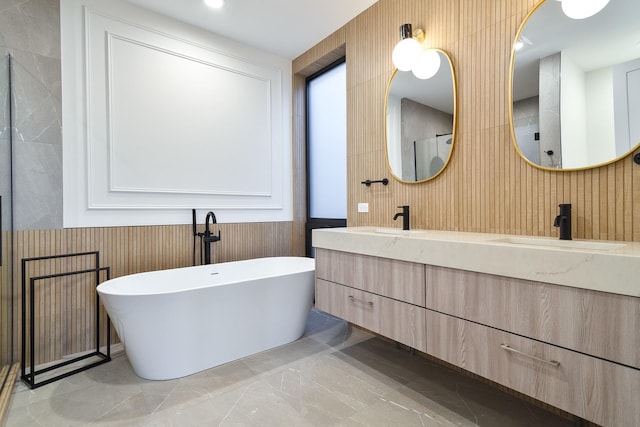 bathroom with vanity and a tub to relax in