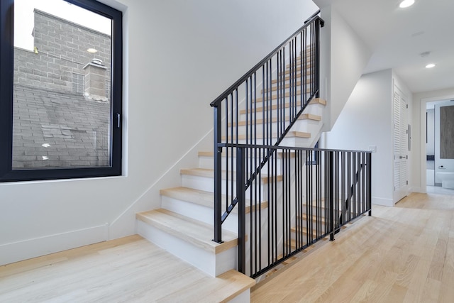 stairway with wood-type flooring