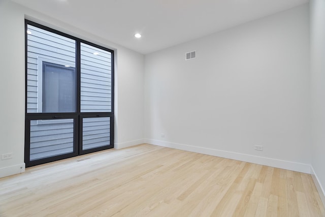 empty room with light wood-type flooring