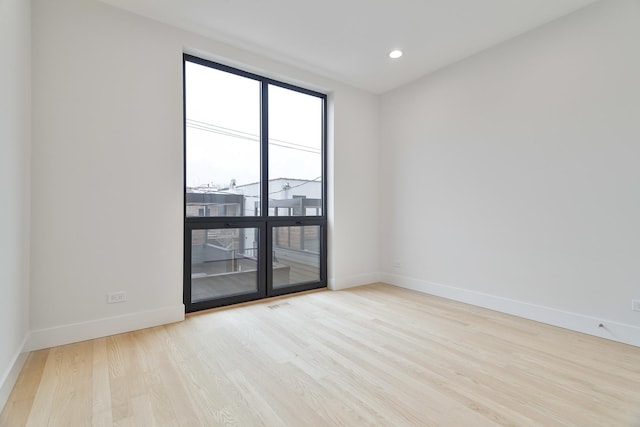 unfurnished room featuring light hardwood / wood-style flooring