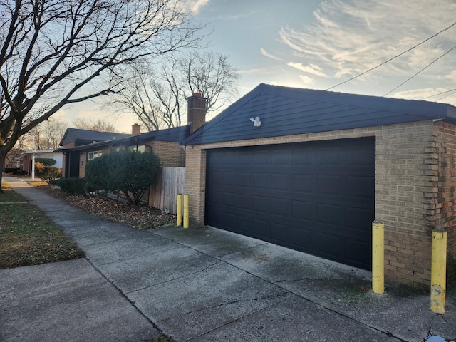 property exterior at dusk with a garage