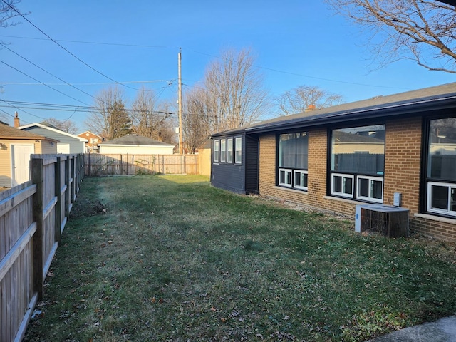 view of yard featuring central AC unit