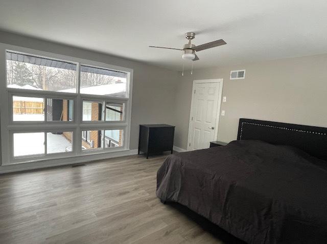 bedroom featuring ceiling fan and hardwood / wood-style floors