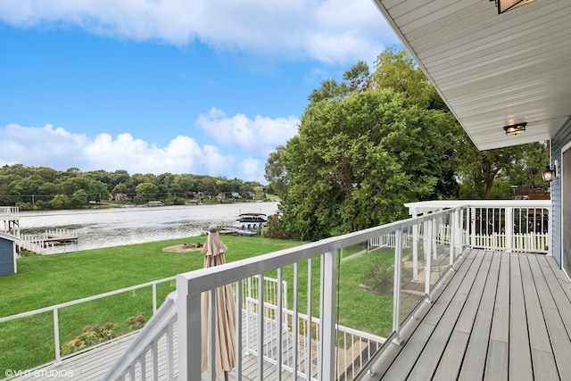 deck featuring a yard and a water view