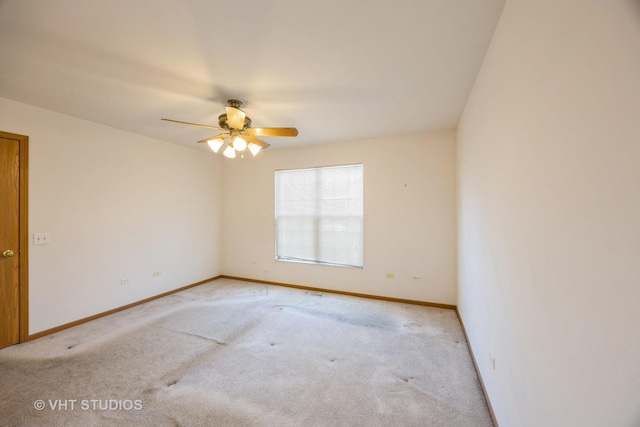 unfurnished room with ceiling fan and light carpet