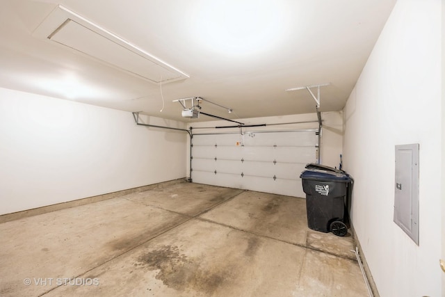 garage with electric panel and a garage door opener