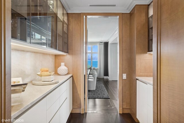 1540 N Lake Shore Dr Unit 8N, Chicago, IL 60610 - hallway featuring ornamental molding and dark wood finished floors