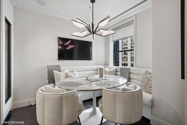 1540 N Lake Shore Dr Unit 8N, Chicago, IL 60610 - dining area with a chandelier, crown molding, and dark wood finished floors