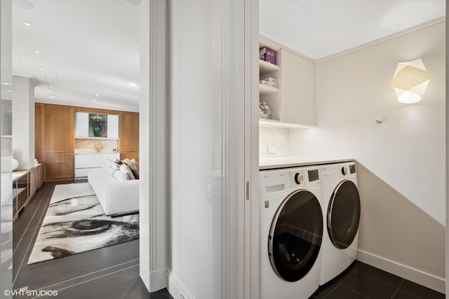 1540 N Lake Shore Dr Unit 8N, Chicago, IL 60610 - washroom featuring washer and clothes dryer, recessed lighting, and dark tile patterned flooring