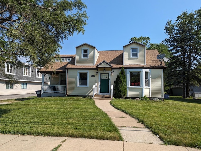 view of front facade with a porch and a front lawn