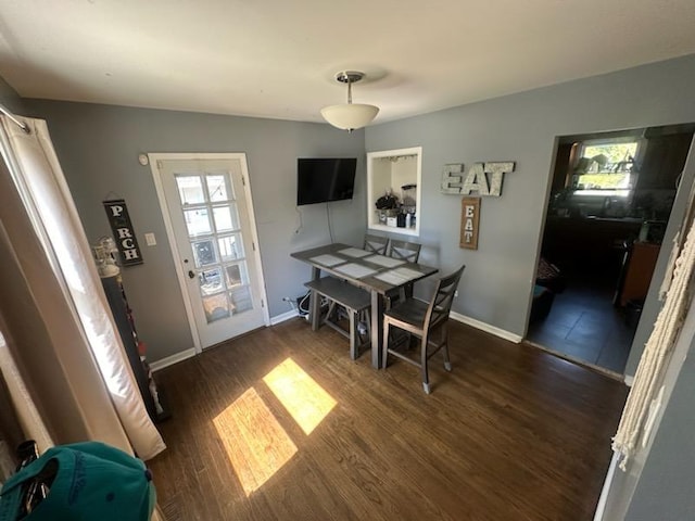 dining room with dark hardwood / wood-style floors