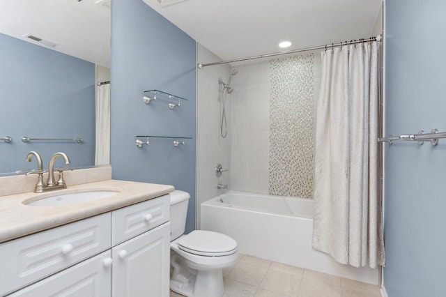 full bathroom featuring tile patterned floors, vanity, toilet, and shower / tub combo with curtain