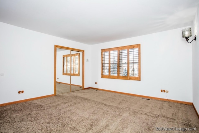 unfurnished room with carpet