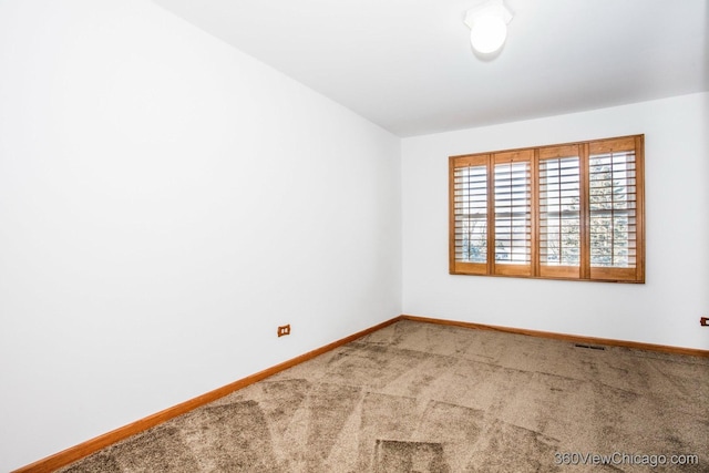 empty room featuring carpet floors