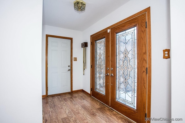 entryway featuring light hardwood / wood-style flooring and french doors