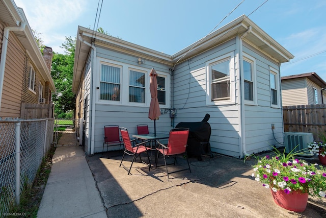 back of house featuring cooling unit and a patio area