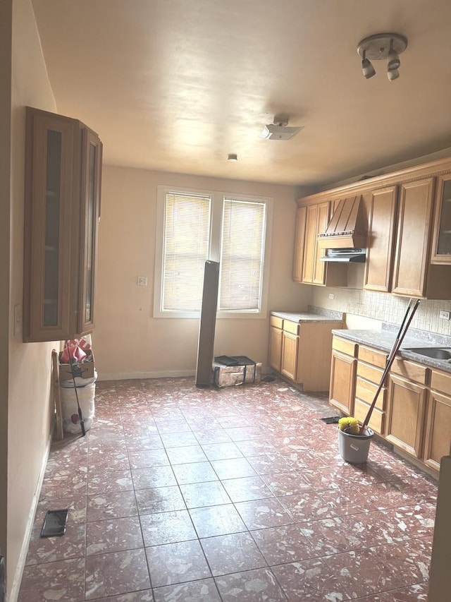 10642 S Langley Ave, Chicago, IL 60628 - kitchen with glass insert cabinets, baseboards, tasteful backsplash, tile patterned floors, and custom range hood