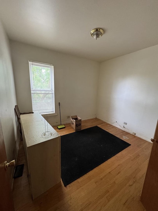 10642 S Langley Ave, Chicago, IL 60628 - unfurnished office with wood finished floors and baseboards