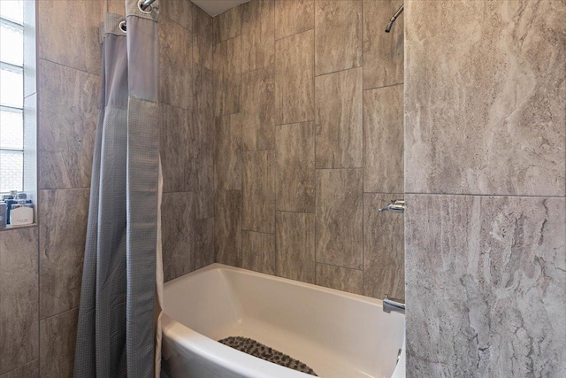 bathroom with shower / tub combo with curtain