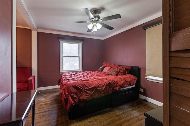 bedroom featuring ceiling fan, ornamental molding, and dark hardwood / wood-style flooring