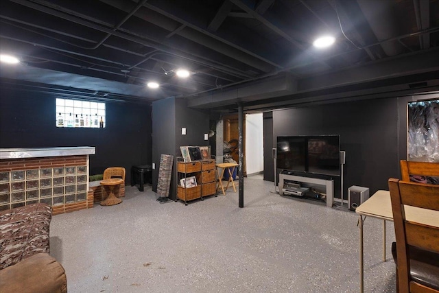 basement featuring indoor bar