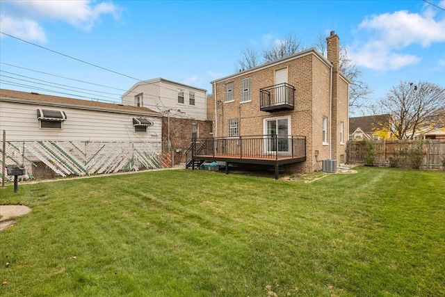 back of house with a wooden deck, a yard, and central air condition unit