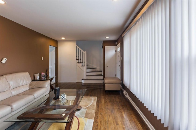 living room with dark hardwood / wood-style floors