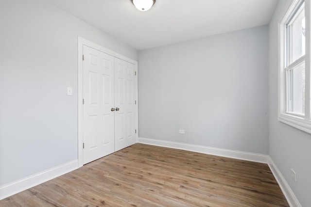 spare room with light hardwood / wood-style floors