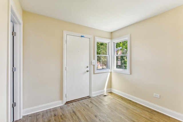 foyer entrance with light hardwood / wood-style floors