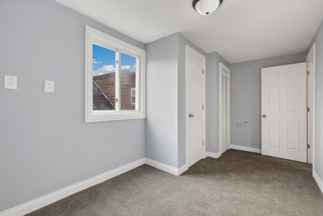 unfurnished bedroom with carpet flooring and a closet