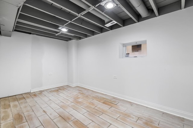 basement featuring light hardwood / wood-style flooring