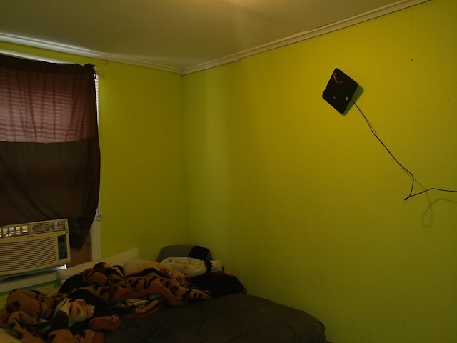 bedroom featuring crown molding and cooling unit