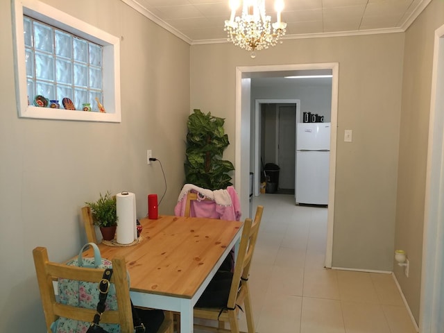 dining room with a notable chandelier and ornamental molding