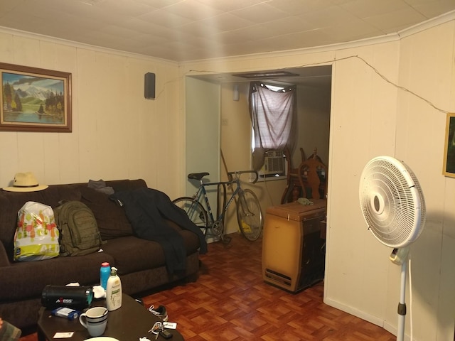 living room featuring dark parquet floors, cooling unit, and ornamental molding