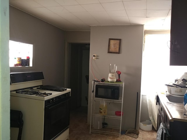 kitchen featuring white gas stove