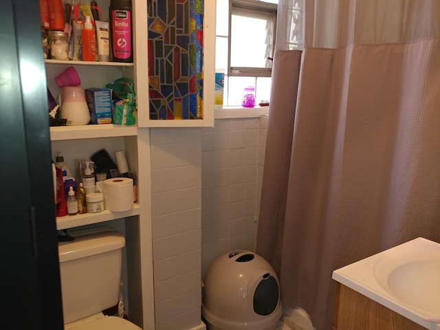 bathroom featuring vanity and toilet