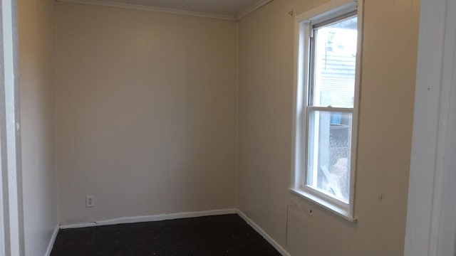 unfurnished room featuring ornamental molding