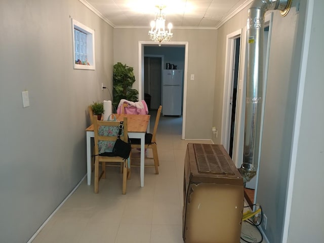 tiled dining room featuring ornamental molding and a notable chandelier