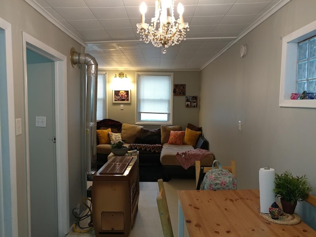 living area with ornamental molding and an inviting chandelier